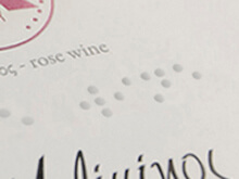 label printed with "embossed print - braille"