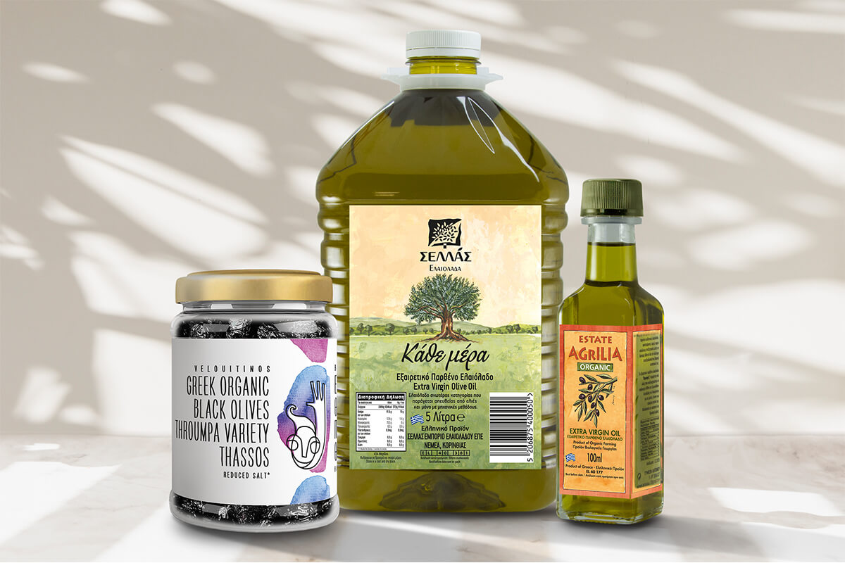 a big plastic jug of olive oil, a smaller glass bottle or olive oil and a jar of black olives. All three have their labels printed