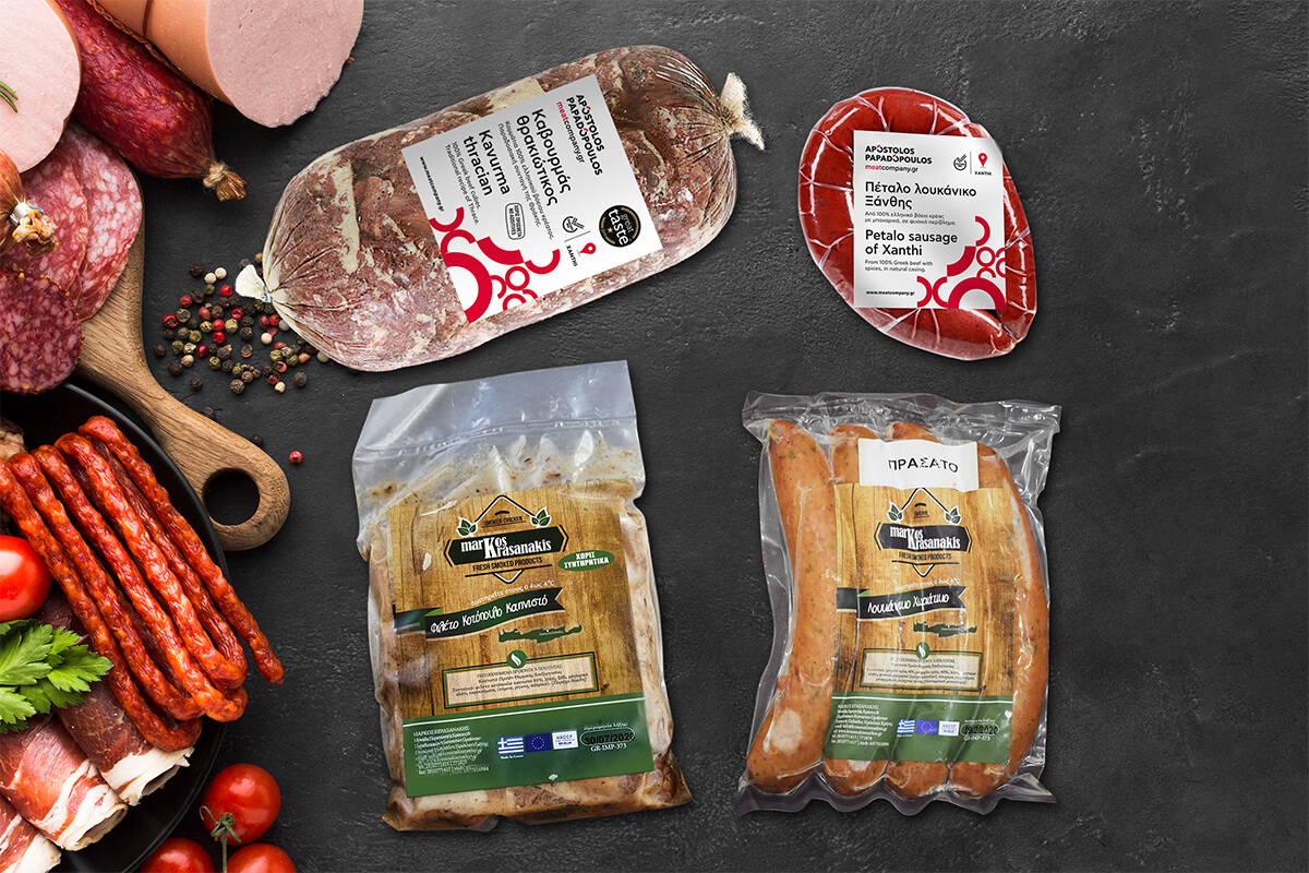 various charcuterie items in their plastic packaging and their labels. Two Sausages, smoked chicken and kavurma